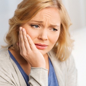 Woman in need of dental implant salvage Jacksonville