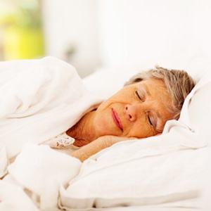 Woman sleeping with dental implants 