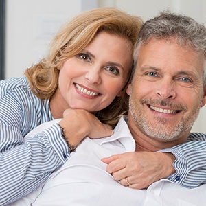 happy older couple with dental implants in Jacksonville