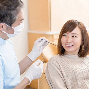 young woman at a dental implant consultation