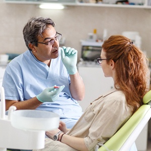 woman talking to dentist